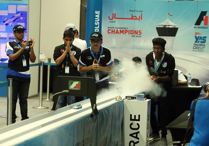 Pupils who set up their own Formula One team and ran it as a business project take part in the F1 Schools International Competition at Yas Marina Circuit in Abu Dhabi. Satish Kumar / The National