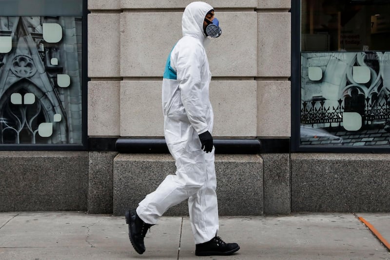 A man wears personal protective equipment as he walks on First Avenue, during the coronavirus disease outbreak in New York City. Reuters