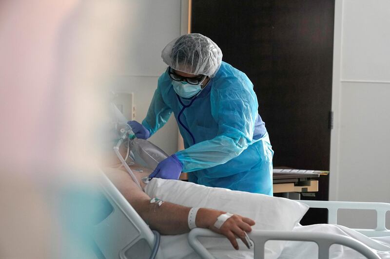 Dr Syed Naqvi, a pulmonologist, treats a coronavirus disease patient in the ICU at SSM Health St  Anthony Hospital in Oklahoma City, Oklahoma, US. Reuters