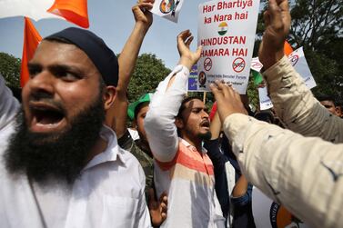 Indians hold placards and shout slogans during a protest organized by several Muslim organisations against a new citizenship law that opponents say threatens India's secular identity in Bangalore, India, Monday, December 23, 2019. AP