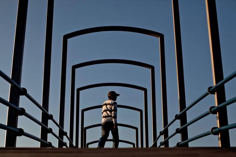 A man walks through Lake Park during the the late afternoon in Abu Dhabi on January 1, 2012. Christopher Pike / The National

For story by: None
Job ID: None