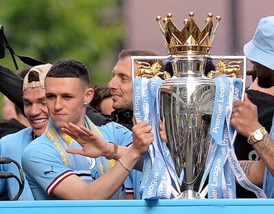 Manchester City's Phil Foden, left, has won five Premier Leagues and was the youngest to do so in 2018 at 17 years and 350 days old. EPA