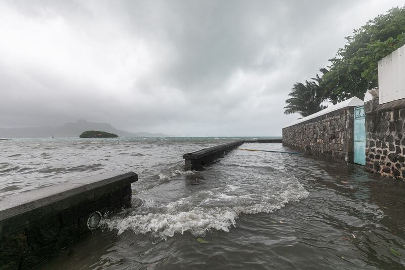 Strong winds and rain batter the Mauritian fishing village. AFP