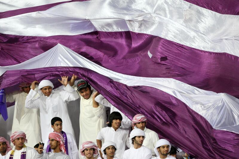 Dubai, United Arab Emirates, Sep 17, 2012 -  Al Ain 's fans celebrate during a match against Al Jazira at  Super Cup final match at Al Wasl Sports Club.  ( Jaime Puebla / The National Newspaper )