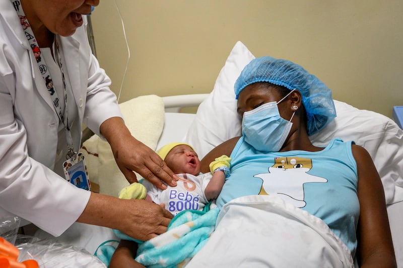 Damaris Ferrera with her baby at Damian Ferrera Altagracia Hospital – in Santo Domingo, Dominican Republic – which symbolically named him the eight billionth inhabitant of the world. AP