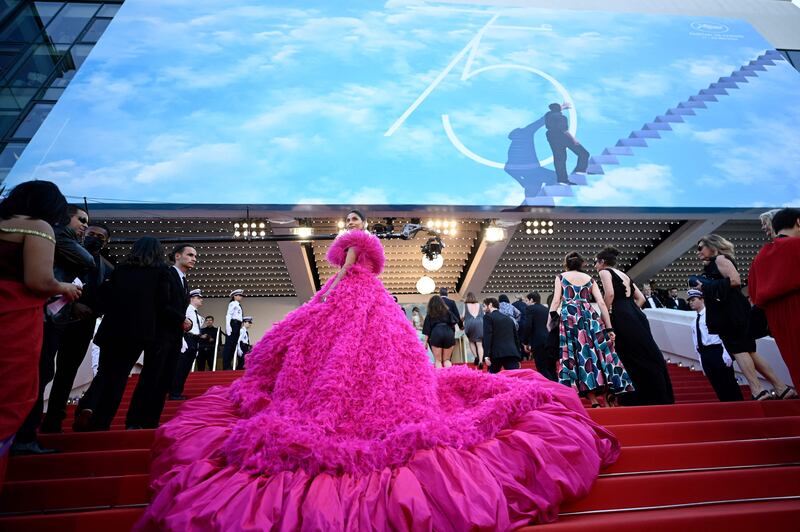 A guest arrives for the 'Final Cut' screening ahead of the opening ceremony of the 75th Cannes Film Festival in southern France, on May 17, 2022. AFP