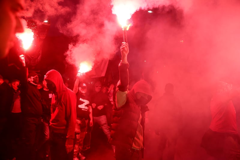 Protesters set off torches during a Pro-Russian protest in Belgrade, Serbia. EPA