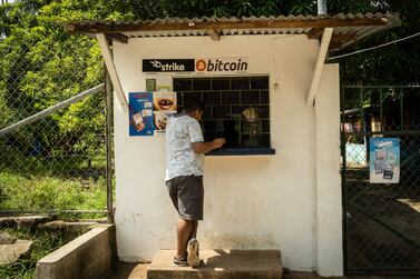 A person purchases a bottle of Coca-Cola from a shop that accepts Bitcoin in El Zonte, El Salvador, which become the first country to formally adopt Bitcoin as legal tender. Bloomberg
