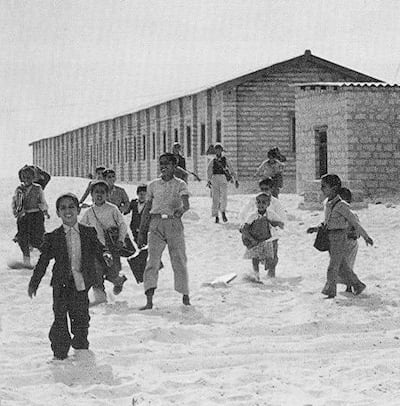 Children outside the first formal school in Abu Dhabi which opened in 1959 in a former warehouse donated by the British authorities