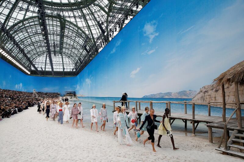 Models present creations by Karl Lagerfeld as part of his Spring/Summer 2019 women's ready-to-wear collection show for fashion house Chanel at the Grand Palais transformed as a beach scene during Paris Fashion Week in France. Stephane Mahe/Reuters