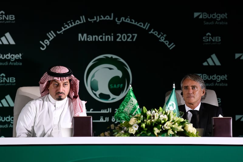 Roberto Mancini and Yasser Al Misehal, the Saudi Arabian Football Federation president, take questions from the press. AP