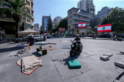 epa07959659 Anti-government protestors remove their tents from the main highway leading to east Beirut, Lebanon, 30 October 2019. Lebanese people started to clear streets in numerous areas as they grant time to the Lebanese President and Parliement to form a new government; and will continue protest in the main squares in all the Lebanese provinces in the second week of demonstrations against proposed tax hikes, and state corruption.  EPA/NABIL MOUNZER