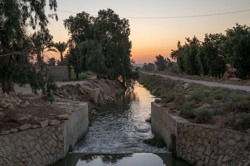 A source of water branching out of the Yusuf Canal, which flows from the Nile through Fayoum, in Qouta town, Egypt, Wednesday, Aug. 5, 2020. Egypt, which relies on the Nile for more than 90% of its water supplies, including drinking water, industrial use and irrigation, fears a devastating impact if The Grand Ethiopian Renaissance Dam is operated without taking its needs into account. (AP Photo/Nariman El-Mofty)