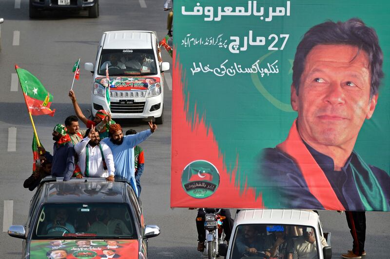 Activists and supporters of Tehreek-e-Insaf travel to a rally. AFP