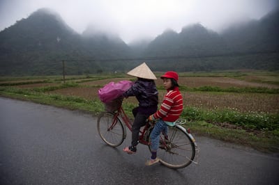 BINH GIA, VIETNAM - 2012/12/28: Students going to school in Binh Gia, Lang Son which is about 160 kilometers north of Hanoi. The temperature is about 10 celcious degree.. (Photo by Chau Doan/LightRocket via Getty Images)