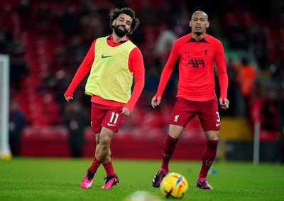 Fabinho, right, says he hopes former Liverpool teammate Mohamed Salah, left, can continue scoring goals for the Merseyside club. PA