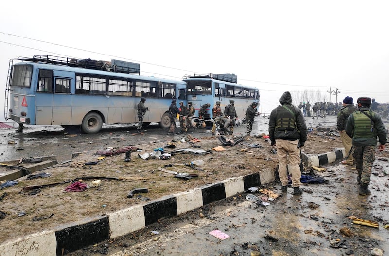 Indian soldiers examine the debris after an explosion in Lethpora in south Kashmir's Pulwama district. REUTERS