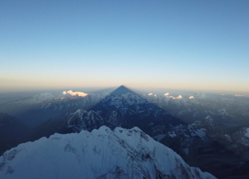 Shadow of Everest is cast on the mountains during sunrise. AFP