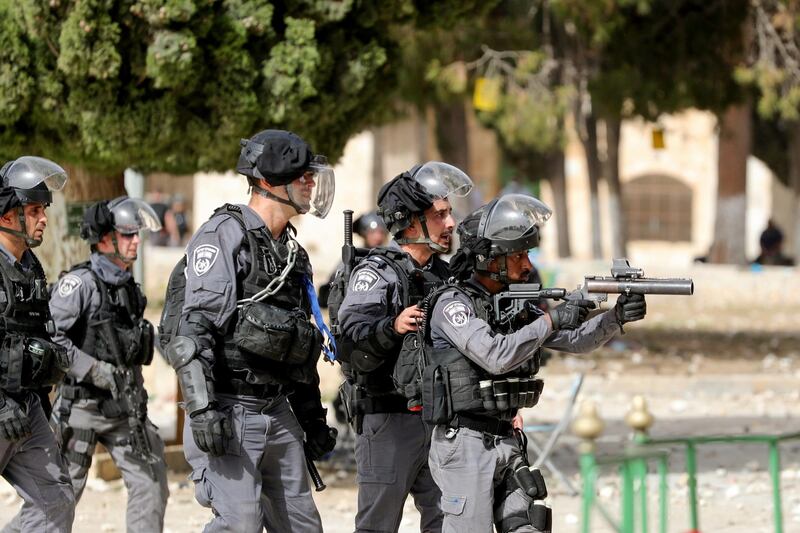 Israeli police take position during clashes with Palestinians at the compound that houses Al Aqsa Mosque. Reuters