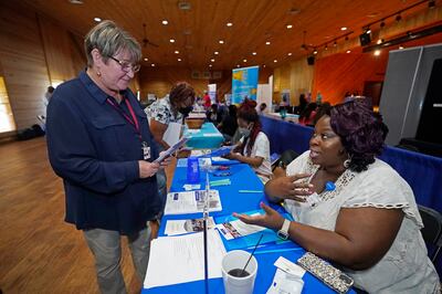 Recruiters and jobseekers at the 2022 Mississippi Re-Entry Job Fair in Jackson. AP
