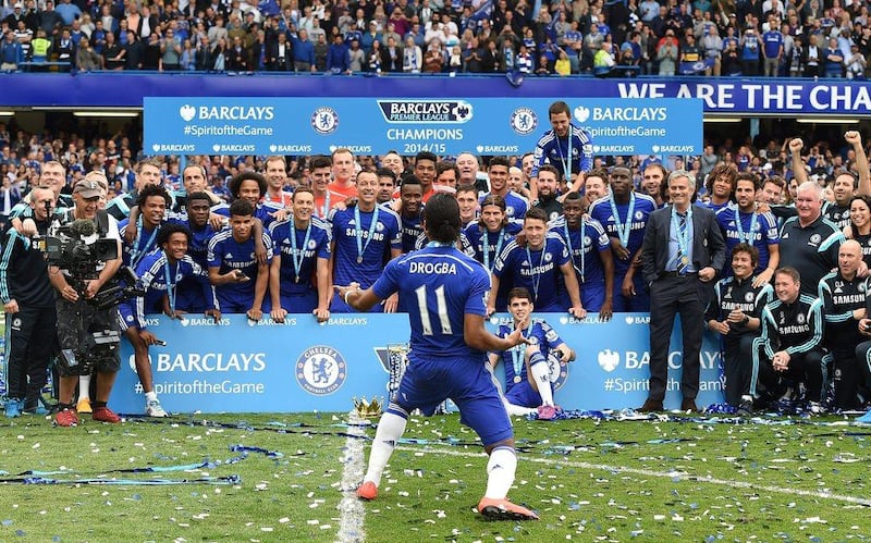 Chelsea player Didier Drogba celebrates with teammates as champions after their final Premier League match of the season on Sunday. Andy Rain / EPA / May 24, 2015  