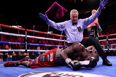 LAS VEGAS, NEVADA - OCTOBER 09: Referee Russell Mora calls the fight after Tyson Fury knocked out Deontay Wilder in the 11th round during their WBC heavyweight title fight at T-Mobile Arena on October 09, 2021 in Las Vegas, Nevada.    Al Bello / Getty Images / AFP
