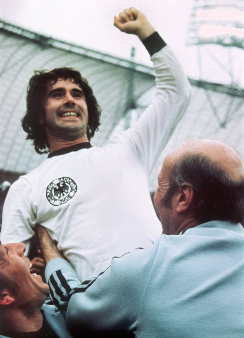 Gerd Muller celebrates with then German national coach Helmut Schon at the Olympic Stadium Munich after the 1974 World Cup final.