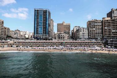 Egyptians bathe during summer vacations at a popular beach in the city of Alexandria. Egypt's private sector grew in July for the second time in 2019. AFP. 