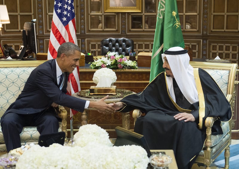 King Salman shakes hands with Barack Obama, US president at the time, at Erga Palace in Riyadh on January 27, 2015. AFP