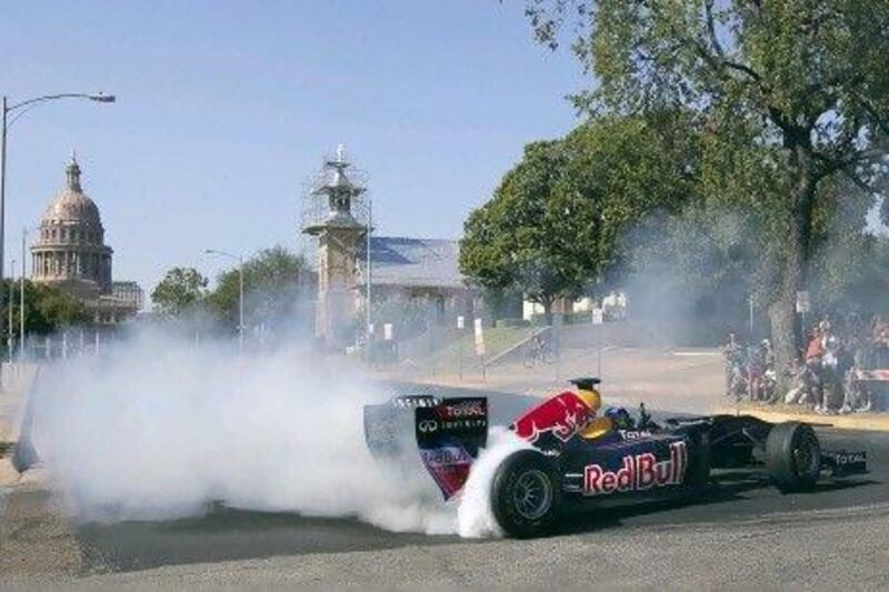 Red Bull Formula One car as the driver, David Coulthard, does a series of doughnuts during the making of a promotional video in Austin, Texas.