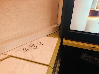 Seats in Etihad's new business class cabin come with wireless charging docks.