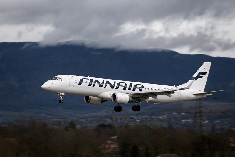 An Embraer 190 commercial plane with registration OH-LKI of Nordic carrier Finnair is seen landing at Geneva Airport on March 11, 2019 in Geneva. (Photo by Fabrice COFFRINI / AFP)