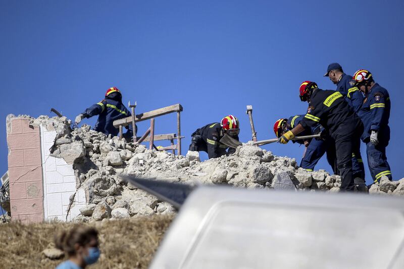 Firefighters search for survivors in the rubble of a church in Arkalochori. Photo: AFP