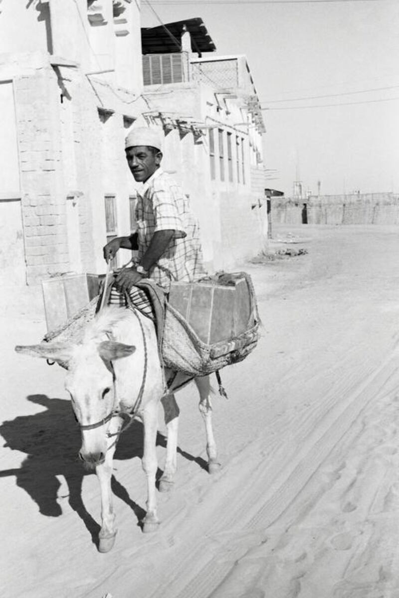 Water Porter, Dubai , 1960sThe Occupations series © Noor Ali Rashid Archives