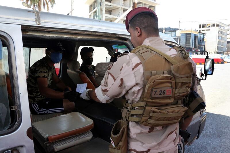 Iraqi soldiers control motorists at a checkpoint in Baghdad's Mansur district, Iraq.  EPA