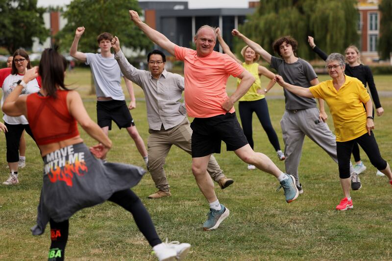 Mr Davey participates in a Zumba class with supporters in Wokingham. Reuters