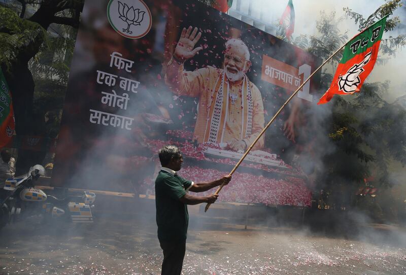 Bharatiya Janata Party (BJP) worker celebrate outside BJP headquarters in Mumbai, India. AP Photo