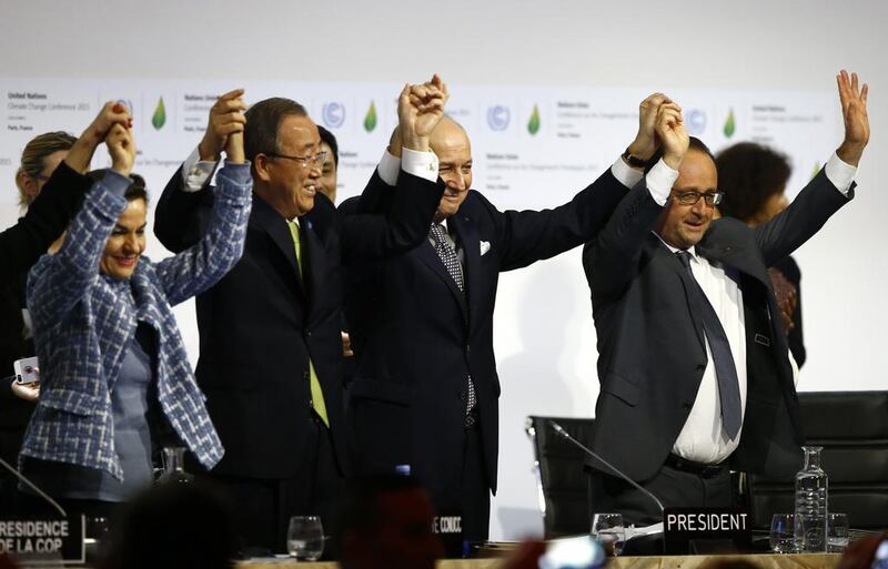 French president Francois Hollande, right, French foreign minister Laurent Fabius, second, right, UN climate chief Christiana Figueres and UN secretary general Ban ki-Moon hold their hands up after the final meeting at COP21, the United Nations conference on climate change in Le Bourget, north of Paris, on December 12, 2015. Francois Mori/AP Photo