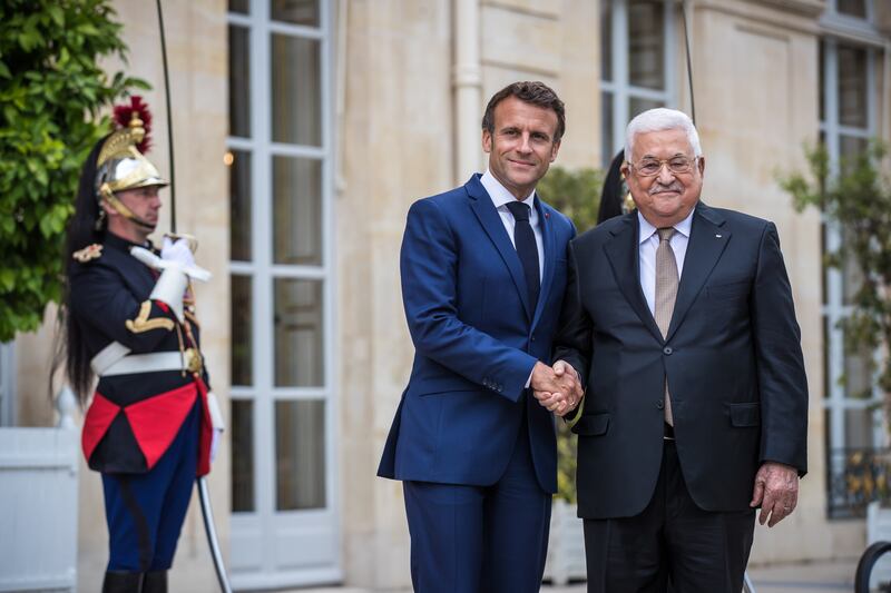French President Emmanuel Macron, left, and Palestinian President Mahmoud Abbas at the Elysee Palace in Paris. EPA