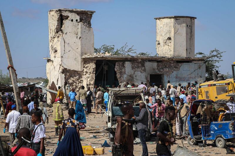 People gather at a car bombing attack site in Mogadishu. AFP