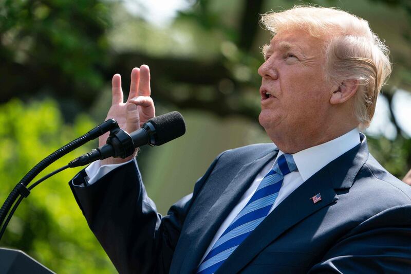 US President Donald Trump delivers remarks on reducing drug costs in the Rose Garden at the White House in Washington, DC, on May 11, 2018. / AFP / NICHOLAS KAMM

