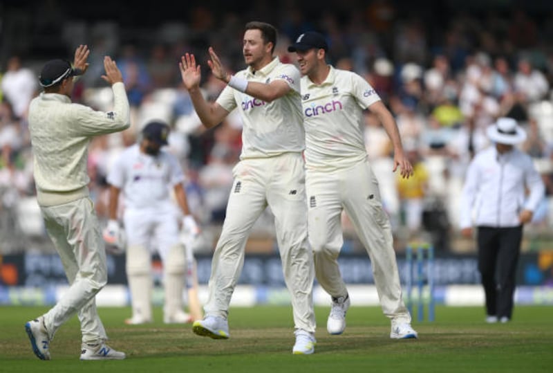 England's Ollie Robinson celebrates with team mates after taking the wicket of Rishabh Pant. Getty
