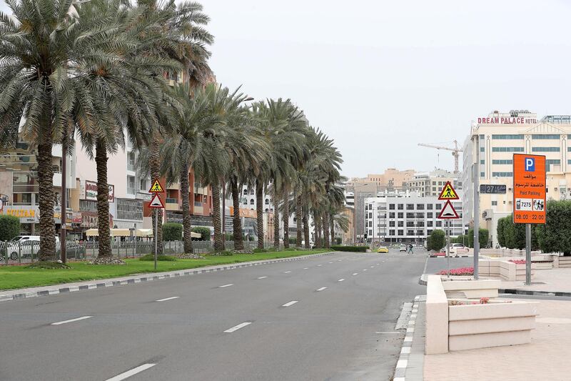 DUBAI, UNITED ARAB EMIRATES , April 11 – 2020 :- View of the empty road at the Al Muraqqabat area in Deira Dubai. Dubai is conducting 24 hours sterilisation programme across all areas and communities in the Emirate and told residents to stay at home. UAE government told residents to wear face mask and gloves all the times outside the home whether they are showing symptoms of Covid-19 or not. (Pawan Singh/The National) For News/Online/Instagram/Standalone