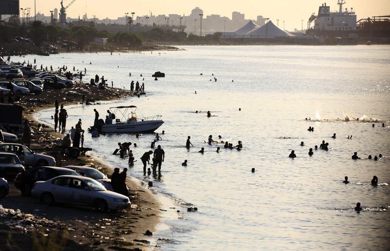 Libyans swim to cool off in the Mediterranean Sea on the Tripoli coast. AFP