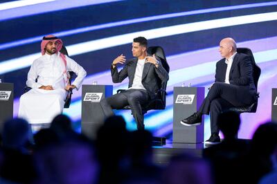 Saudi sports minister Prince Abdulaziz bin Turki Al Faisal with Al Nassr star Cristiano Ronaldo and Fifa president Gianni Infantino during the announcement of the Esports World Cup. Reuters