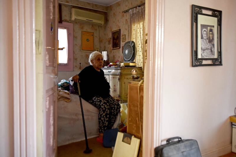 Houseboat owner Ikhlas Helmy, 88, sits in the bedroom of her houseboat.  A government push to remove houseboats from Cairo’s Nile banks has cut the number from several dozen to just a handful.  All photos by AP