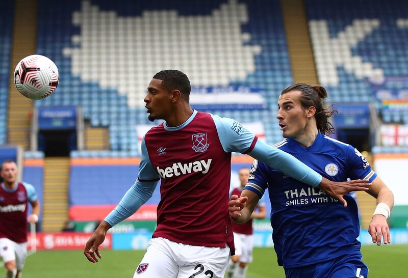 West Ham's Sebastien Haller, left, duels for the ball with Leicester's Caglar Soyuncu. AP