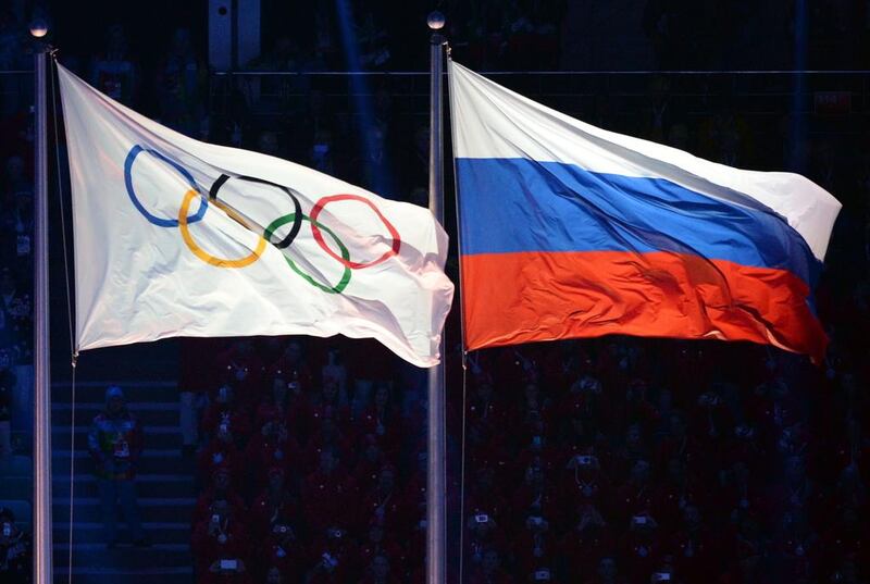 The Olympic and Russian flags during the Opening Ceremony of the Sochi Winter Olympics on February 7, 2014 in Sochi. AFP