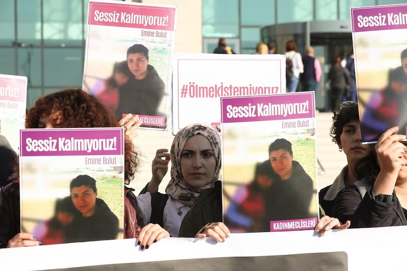 Women hold placards of Emine Bulut, who was killed by her husband, as they gather outside the Kirikkale court house for the first hearing in the central Anatolian city of Kirikkale on October 9, 2019.  A high-profile trial began on october 9, 2019, over the murder of a Turkish woman whose stabbing by her ex-husband was caught on video and triggered a debate over a spike in femicide.  The killing of 38-year-old Emine Bulut in August sparked outrage across Turkey and reignited the debate over mounting violence against women in the country.  Bulut, who had divorced her husband four years earlier, was stabbed in a cafe in front of her 10-year-old daughter. She later died in hospital.
 / AFP / Adem ALTAN
