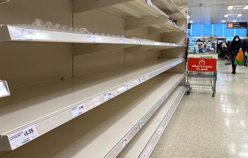 Empty shelves inside a Sainsburys supermarket in Watford, southern England. Reuters